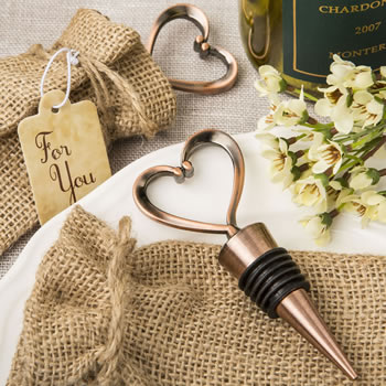 Vintage heart shaped all metal bottle stopper in an antique copper plated finish