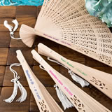 Intricately carved personalized Sandalwood fan favors from fashioncraft with box